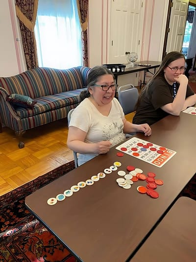 Residents enjoying a game of bingo in a community room