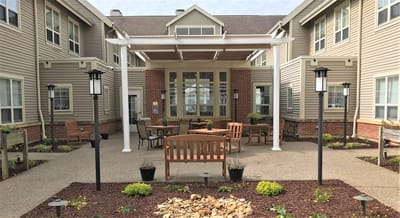 Outdoor seating area with benches and lights