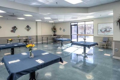 Bright dining area with tables set for a meal