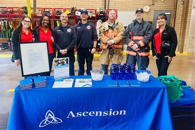 Group photo at a community event with staff and guests