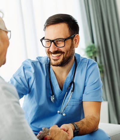 Healthcare professional engaging with a senior resident