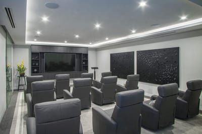 Interior common area with seating and a large TV