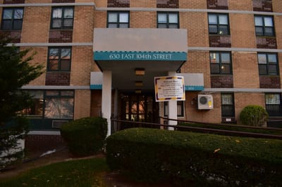 Front entrance of a senior living facility with signage