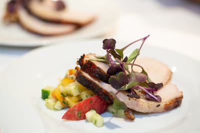Plate of grilled chicken with fresh vegetables
