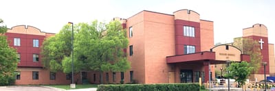 Exterior view of a nursing home facility with trees