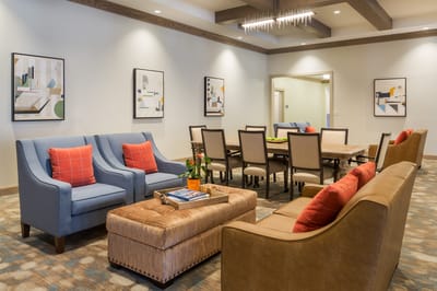 Comfortable lounge area with seating and artwork