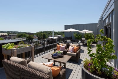 Outdoor terrace with seating and umbrellas