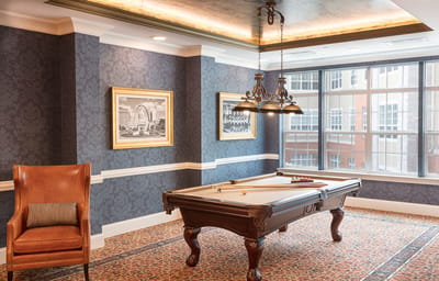 Common area with a pool table and seating