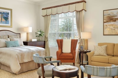 Comfortable resident room with bed and seating area
