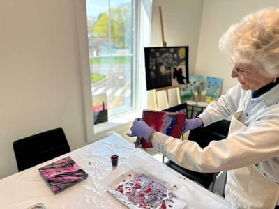 Resident engaged in a painting activity
