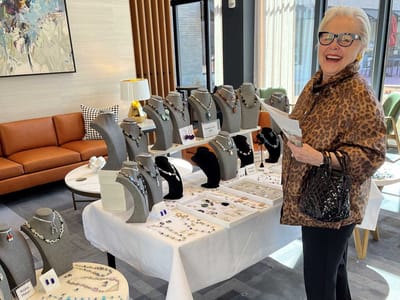 Resident enjoying a jewelry display in the common area