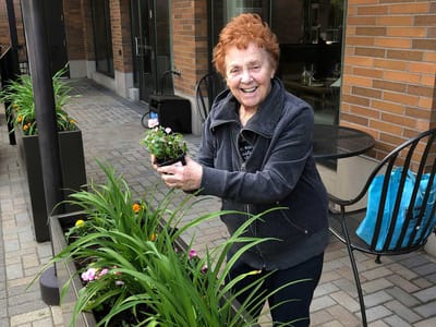 Resident gardening in an outdoor space