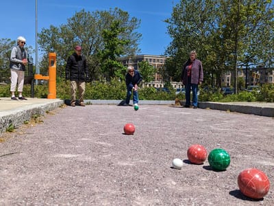 Residents participating in an outdoor bocce activity
