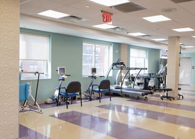 Interior view of a rehabilitation center gym with fitness equipment