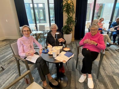Residents enjoying snacks and drinks in a common area