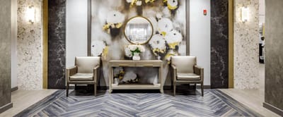 Bright lobby area with floral accents and seating