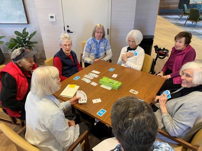Residents playing cards in a common area