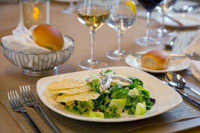A well-plated salad with dining setup
