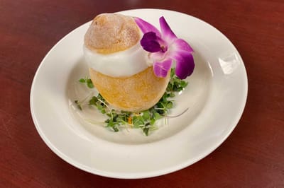Gourmet dessert presented with a flower garnish