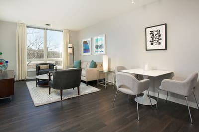 Bright, modern living space with seating and artwork