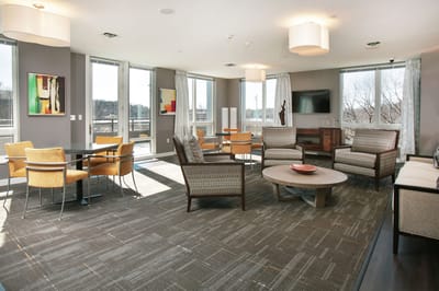 Bright common area with seating and natural light