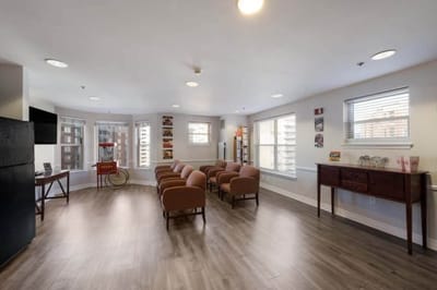 Bright common area with seating for residents