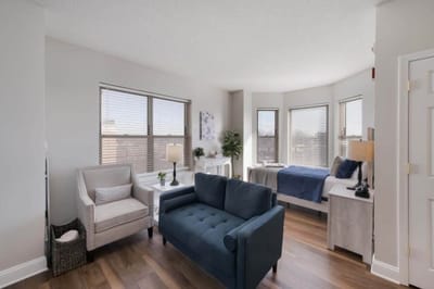 Cozy resident room with seating and natural light