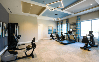 Well-lit fitness area with exercise equipment