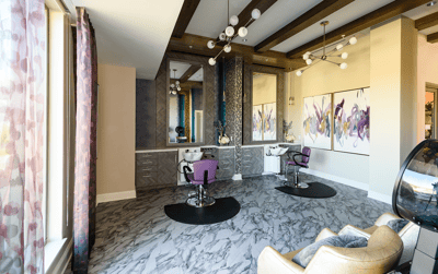 Bright interior of a salon with styling chairs and mirrors
