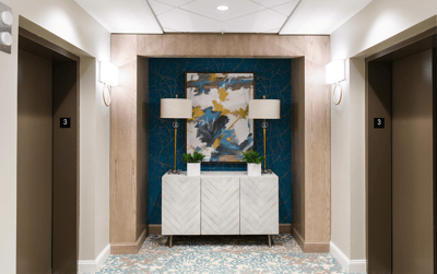 Brightly lit corridor with artwork and decorative elements
