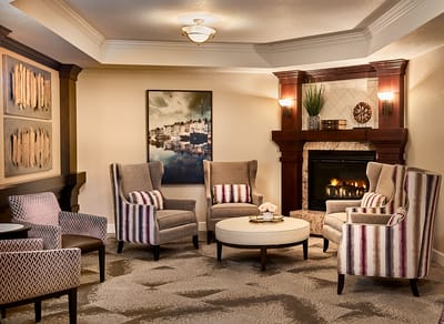 Cozy lounge area with comfortable seating and a fireplace