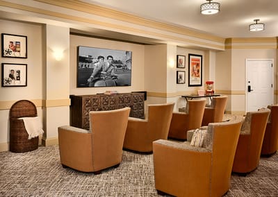 Common area with comfortable seating and a large TV