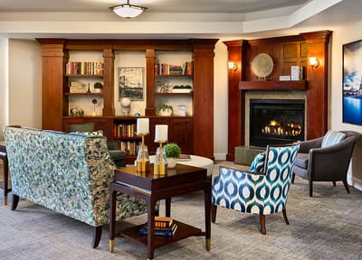 A cozy common area with seating and a fireplace