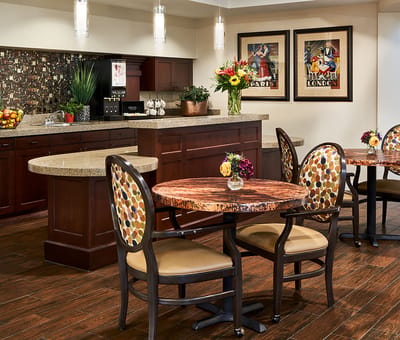 Common area with tables and decor in a senior living facility