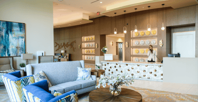 Bright lobby area with seating and friendly staff