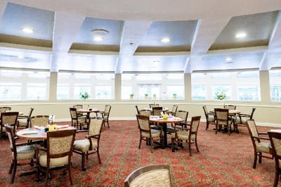Bright dining room with tables set for meals