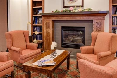 Cozy common area with a fireplace and seating