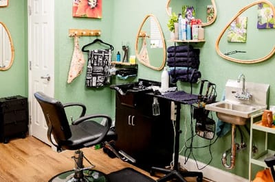 Salon area with styling chairs and mirrors