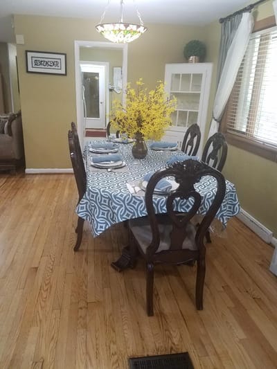 Dining table set with flowers in a cozy dining area