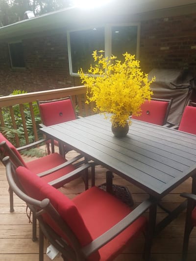 Outdoor seating area with a flower centerpiece