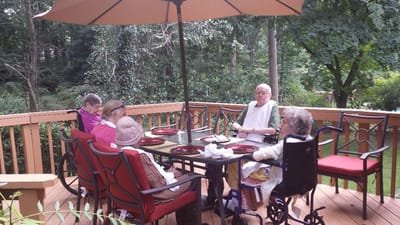 Residents enjoying a meal on the patio