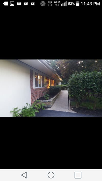 Pathway leading to a brightly lit assisted living building
