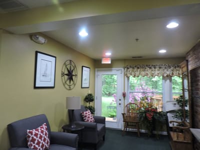 Interior common area with seating and views of outdoor space