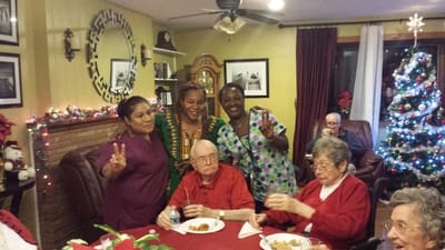Residents enjoying a festive gathering in a cozy common area
