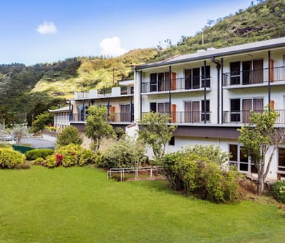Exterior view of Pālolo Chinese Home surrounded by gardens