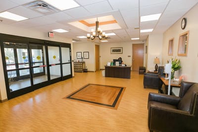 Reception area with a staff member at the front desk