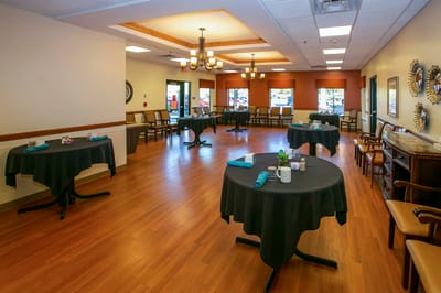 Bright common area with tables set for activities