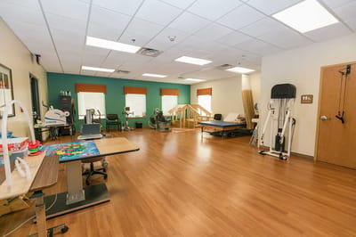 Interior view of a rehabilitation area with exercise equipment