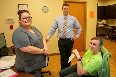 Staff members interacting in an office setting