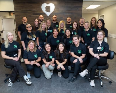 Staff posing together in a friendly group photo